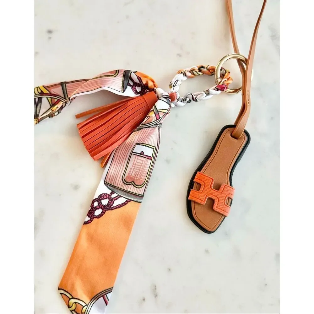 Bright orange purse charm flip-flop and pattern scarf
